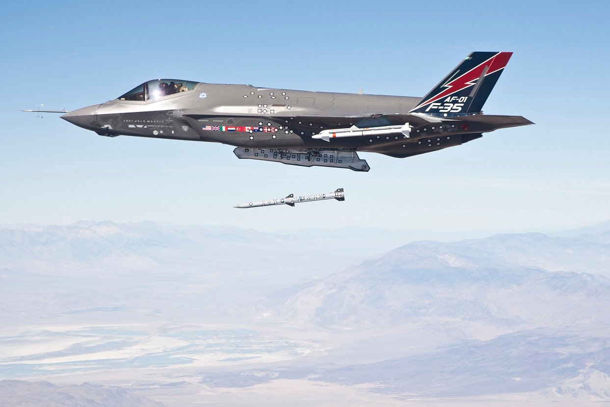 F-35 fighter in the sky launching a missile.