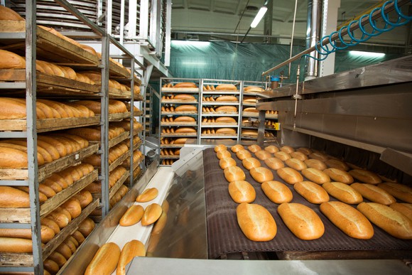 Bread being produced at bakery.