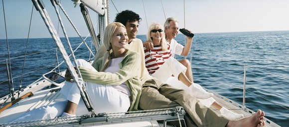 Four people on a high-end sailboat.