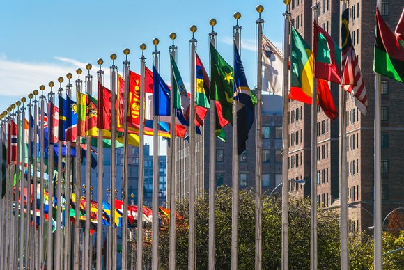 Flags from UN member countries outside UN building.