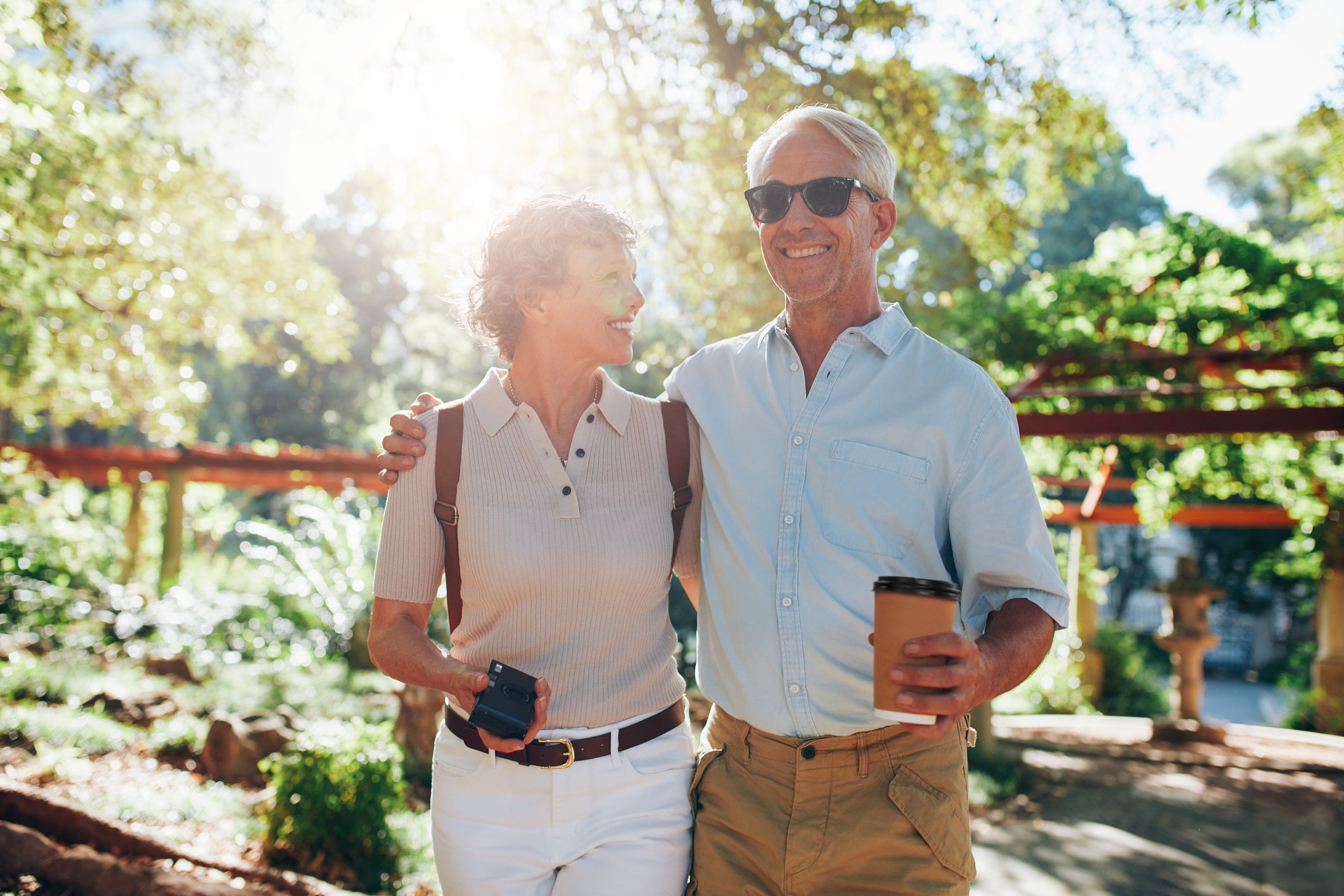 Senior couple outdoors, smiling