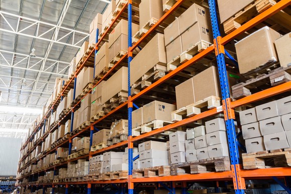 Interior view of a warehouse showing boxes on racks.