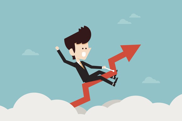 Cartoon of a business person riding a stock chart high above the clouds