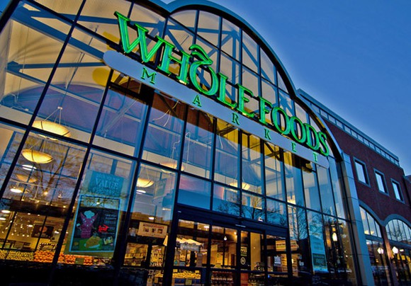 The glass facade of a Whole Foods store in Salt Lake City