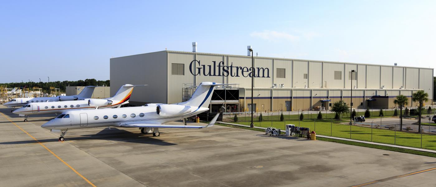 Gulfstream jets in front of production hangar.