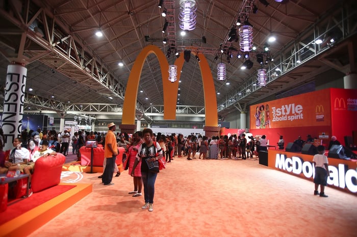 Golden Arches hanging over a convention floor.