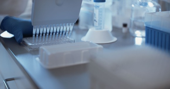 Lab table with samples in vials and evaluation equipment.