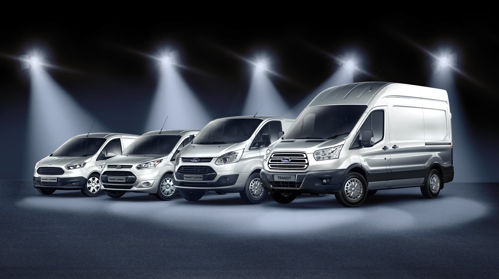 Ford's four Transit van models, parked side to side. From small to large: Transit Connect, Transit Courier, Transit Custom, and Transit.