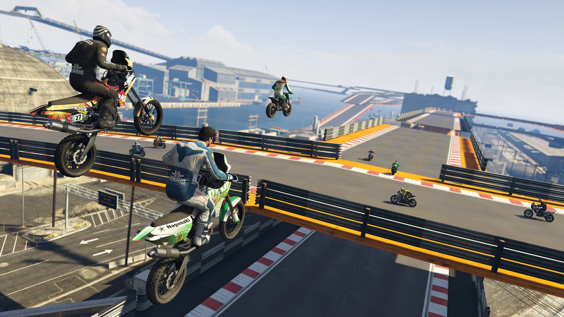 Three people on motorcycles sailing through the air over a bridge in "Grand Theft Auto V".