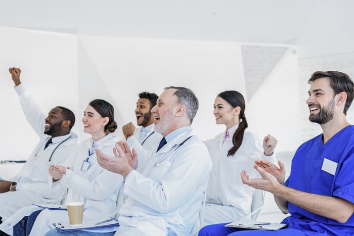 A group of medical professionals cheering.