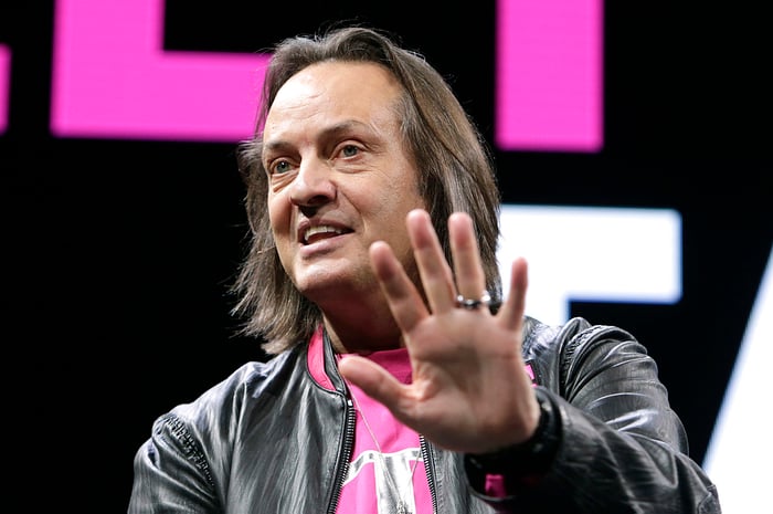 T-Mobile CEO John Legere with his hand outstretched