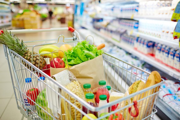 A shopping cart full of groceries.