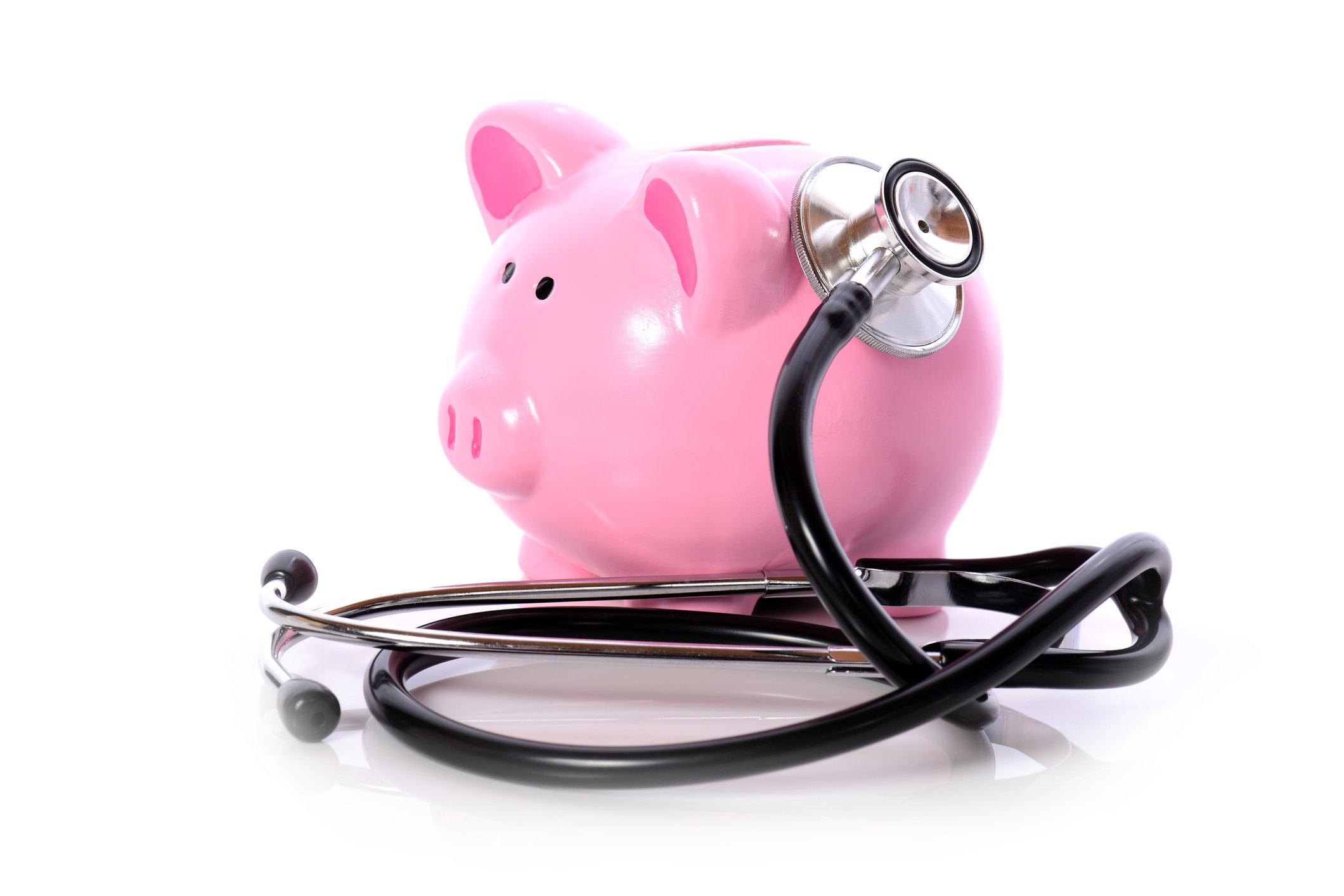 A stethoscope listens to a piggy bank.