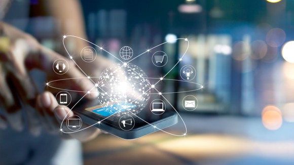 A smartphone with the images of apps superimposed above it.