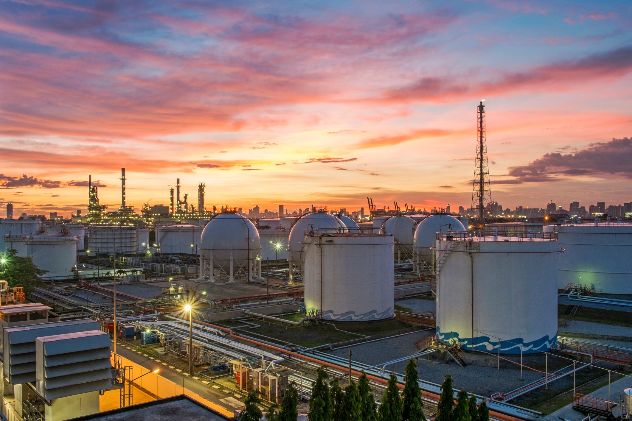 A refinery under a twilight sky.