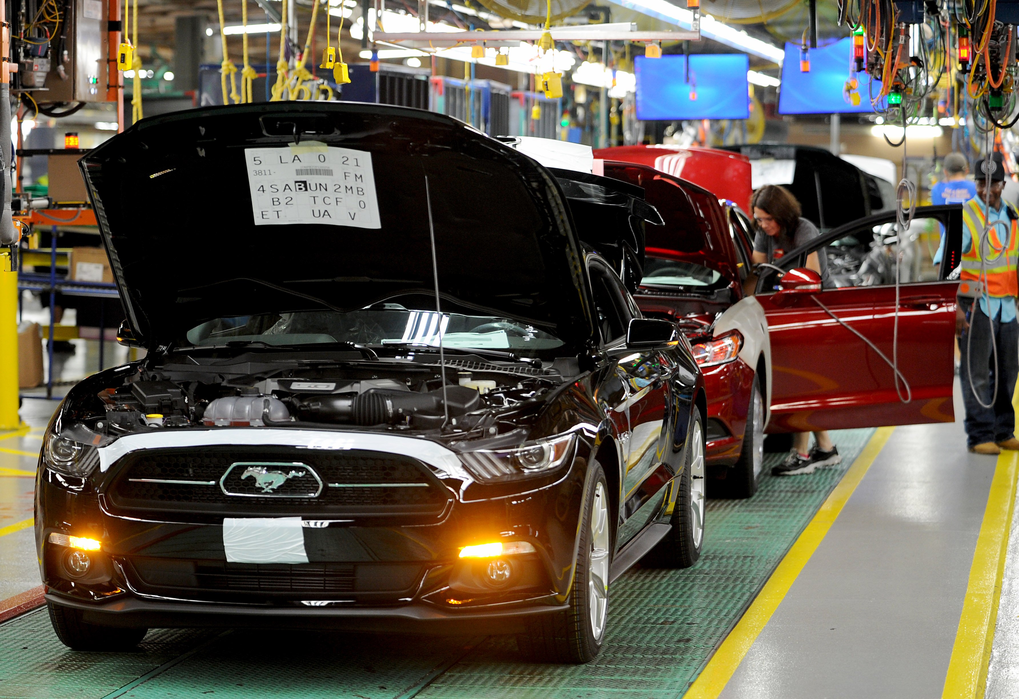 Nearly finished Ford Mustangs are shown on an assembly line at Ford's factory in Flat Rock, Michigan. 