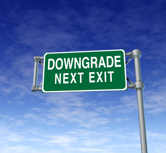 Freeway sign that reads "Downgrade next exit"