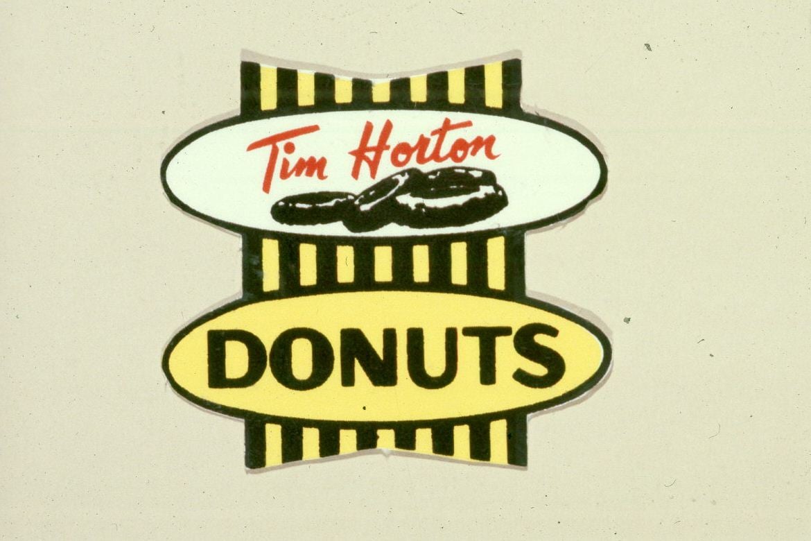 Original Tim Horton's logo with "donuts" written below "Tim Horton".
