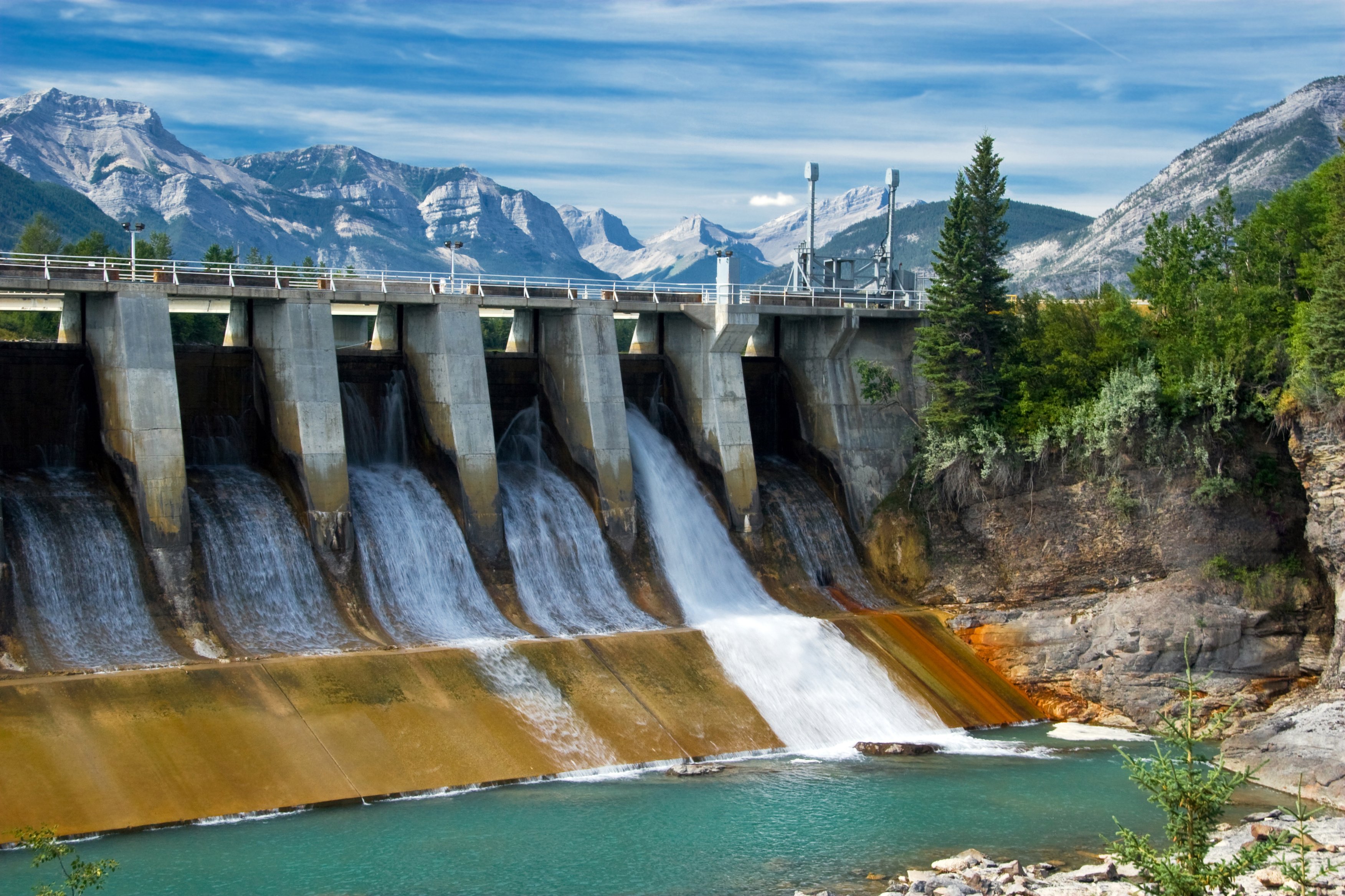 A hydroelectric dam on a river in the mountains.