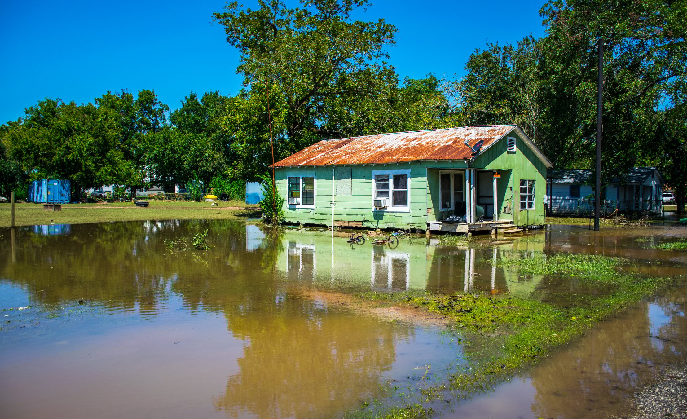 The exterior of a flooded home following a storm.