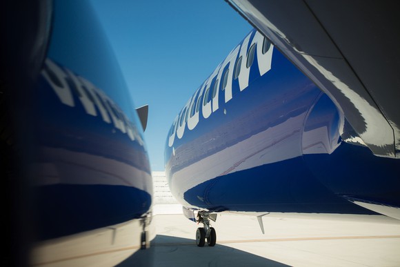 Southwest aircraft reflected on a shiny surface.