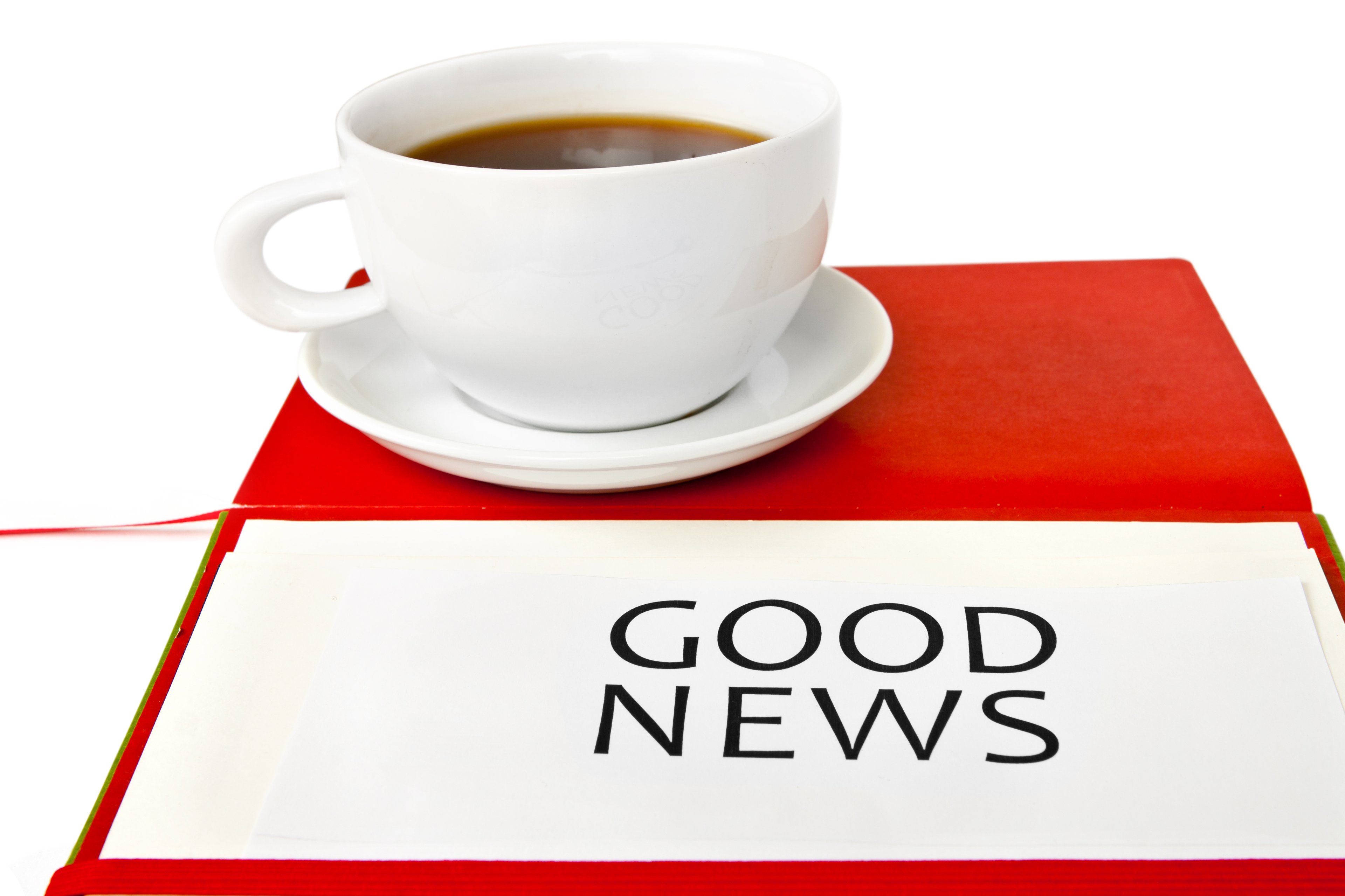 Good news printed on paper with coffee cup