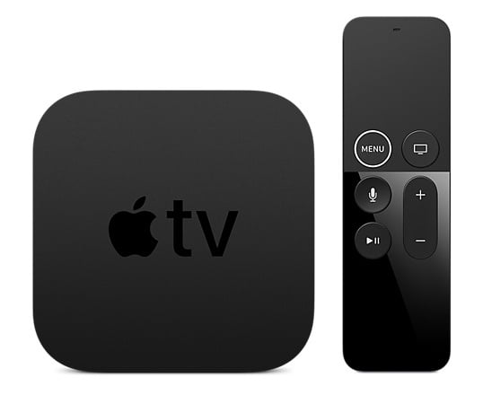 Apple TV box next to its remote.