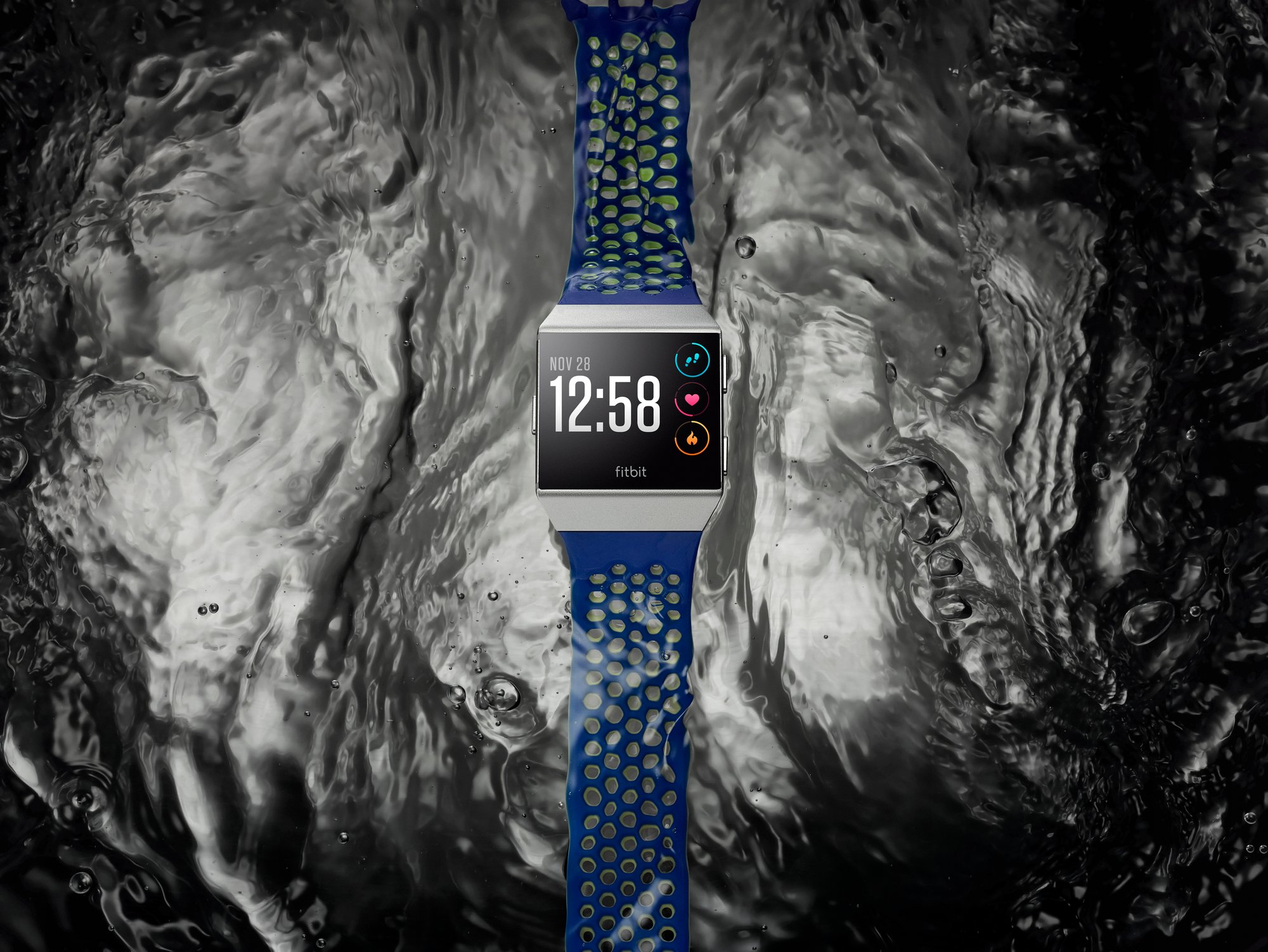 Fitbit Ionic on top of a water background.