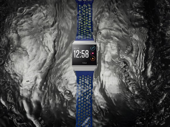 Fitbit Ionic on top of a water background.