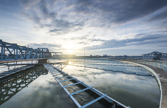 A water treatment plant at sunrise.