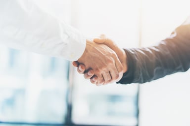 two people shaking hands_GettyImages-528606286