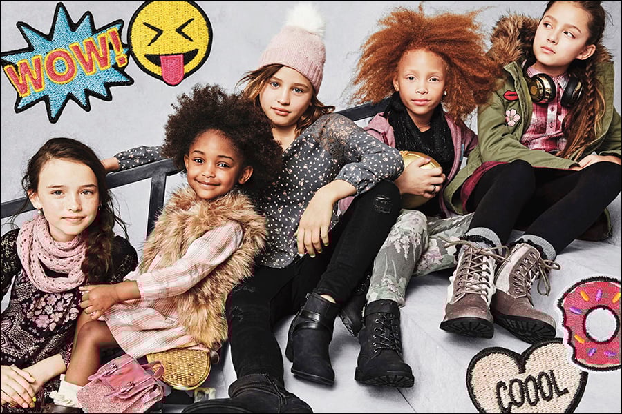 Children pose in Children's Place clothing.