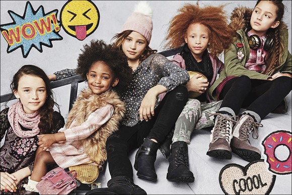 Children pose in Children's Place clothing.