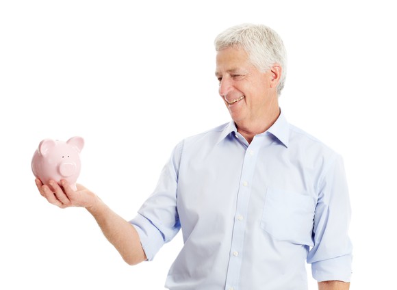 Older gentleman with a piggy bank in hand