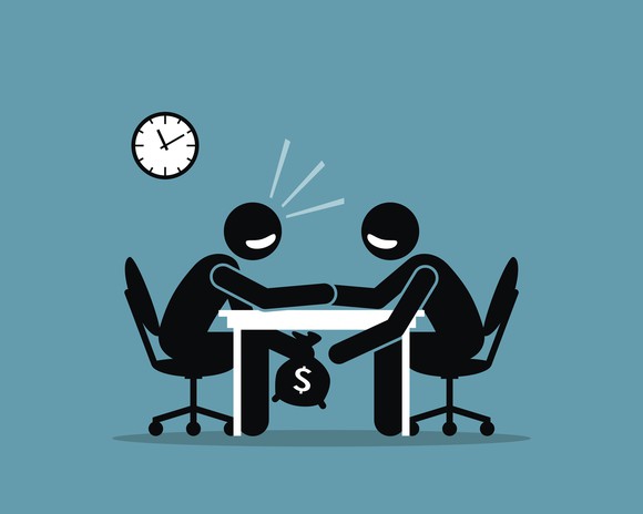 Cartoon of individuals shaking hands at a table while passing money under the table