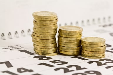 Gold coins on calendar