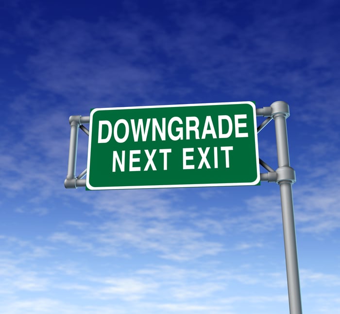 Highway sign that reads "Downgrade next exit"