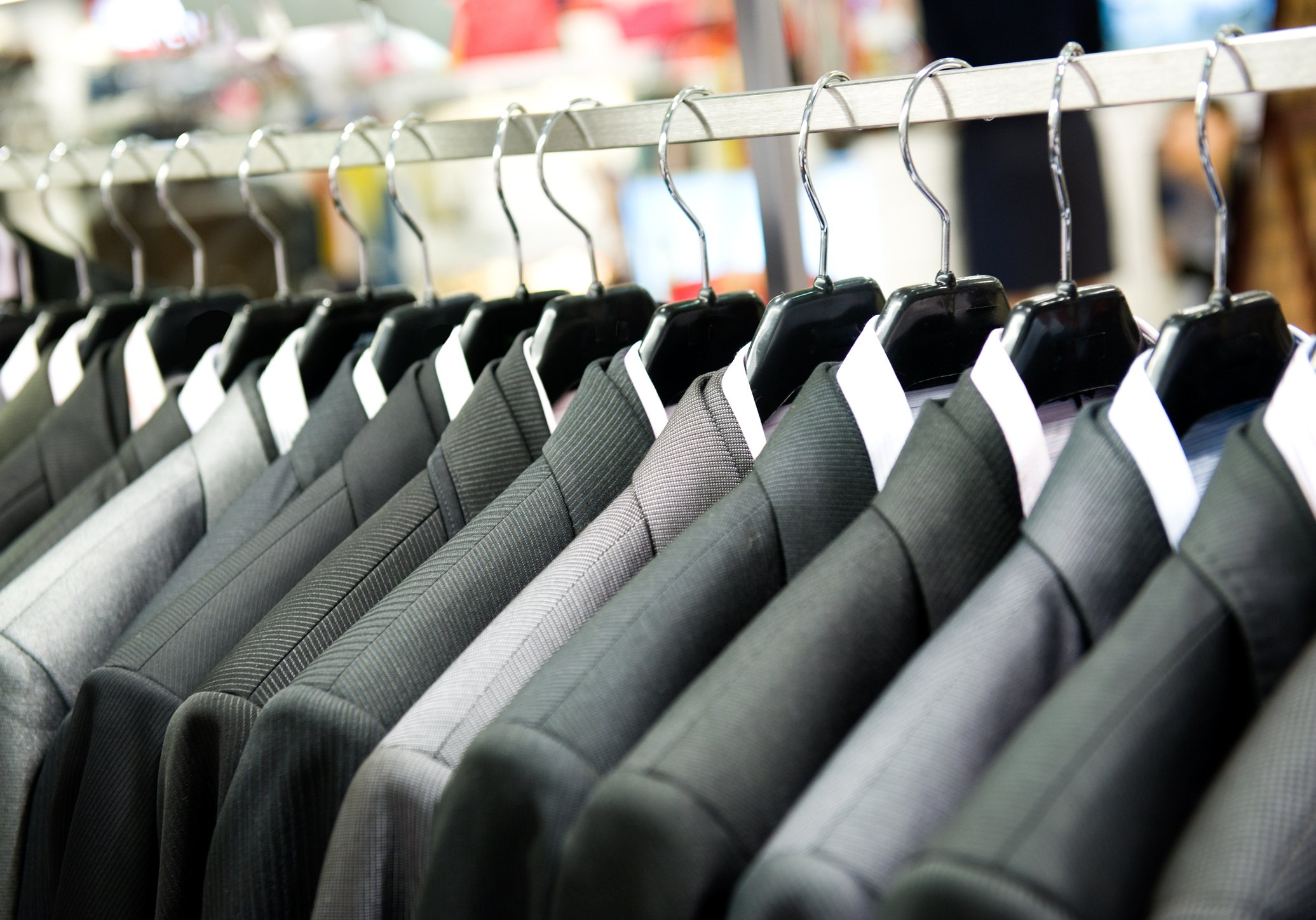 Men's suits hanging on a rack