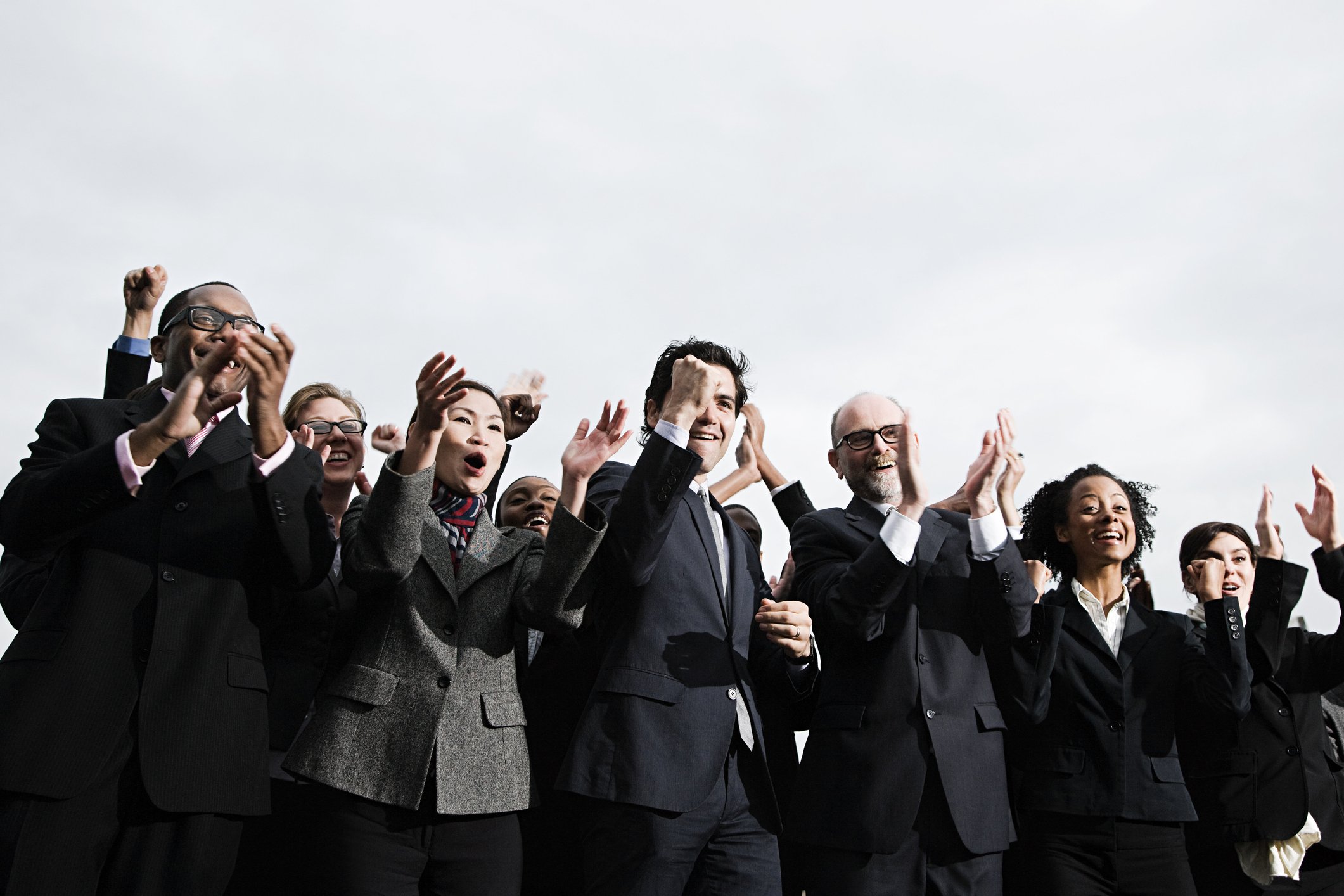 Business people cheering