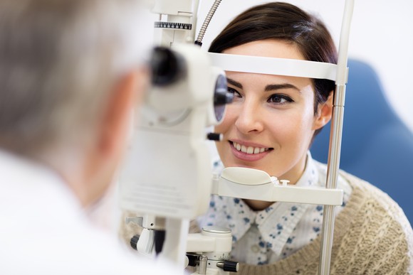 Woman getting eyes examined