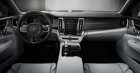 The Polestar 1's front seats and dashboard. Seats are trimmed in gray leather, and the traditional-looking dashboard is trimmed in black.