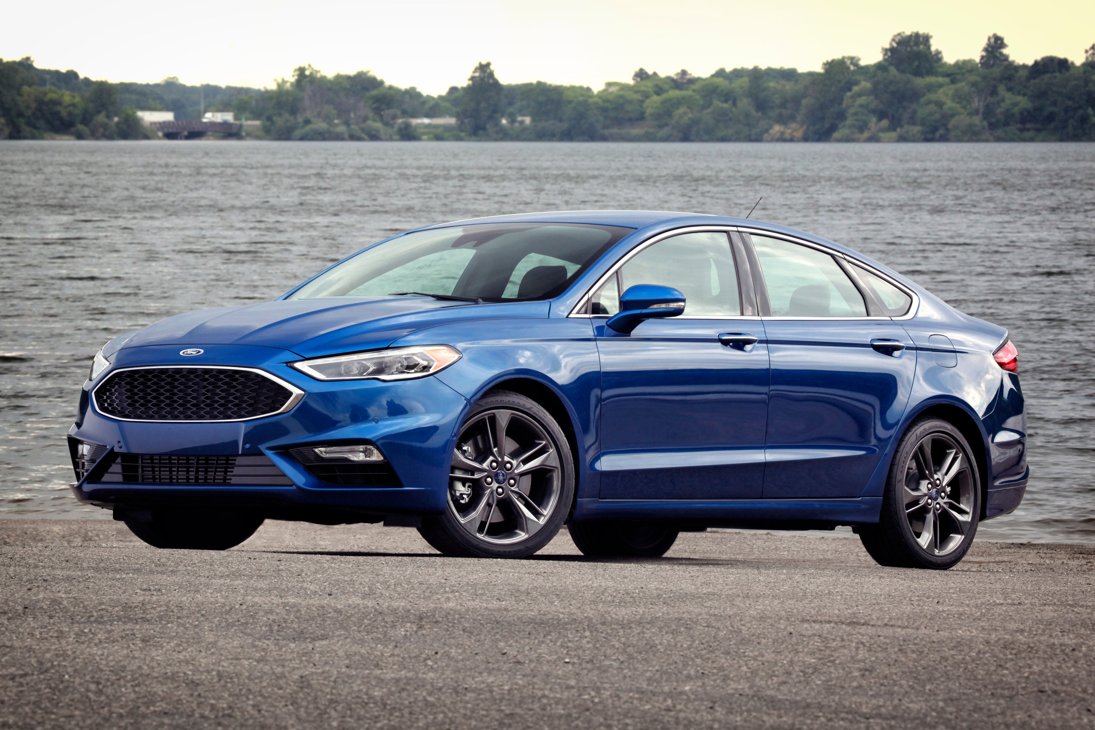A blue 2017 Ford Fusion Sport midsize sedan.