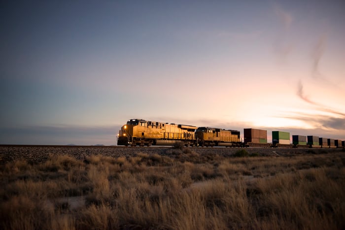 Railroad locomotive at dusk.