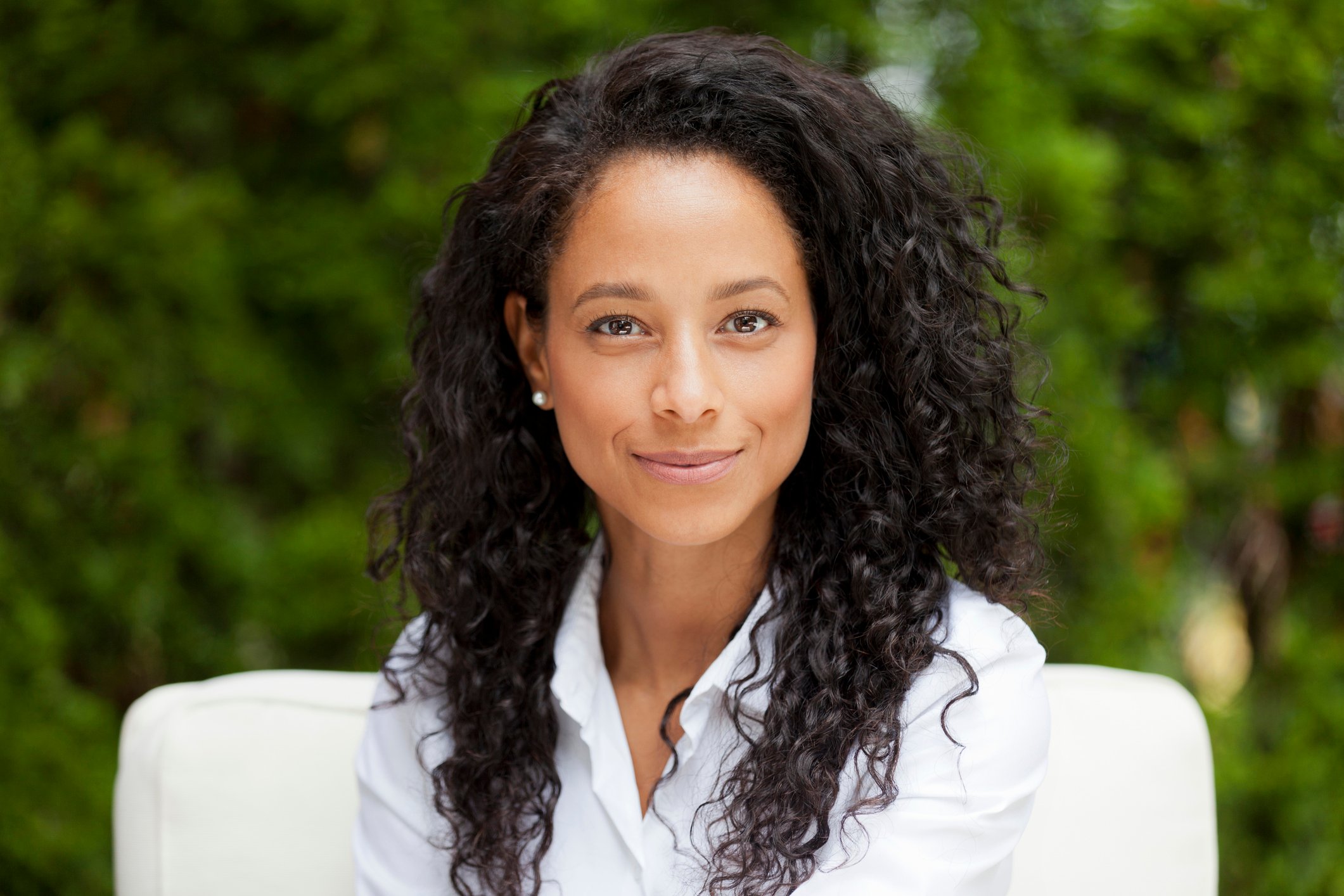 Smiling woman in collared shirt