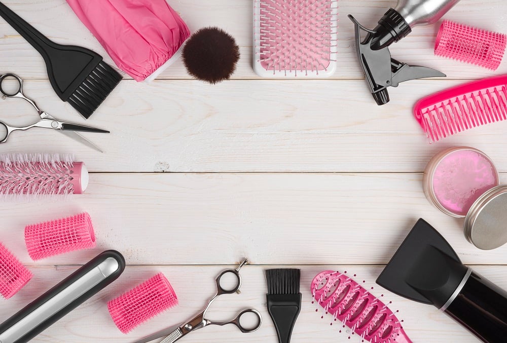 A selection of hair care and beauty products on a table. 