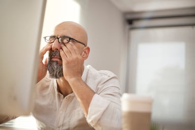 pressure_man rubbing eyes_GettyImages-599680450