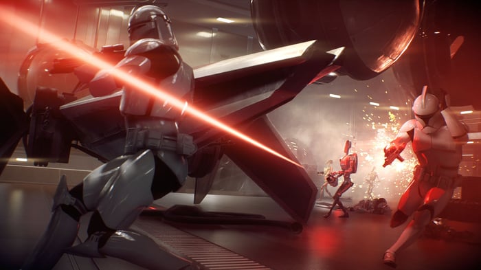 A droid firing a laser at stromtroopers in EA's "Star Wars Battlefront II."