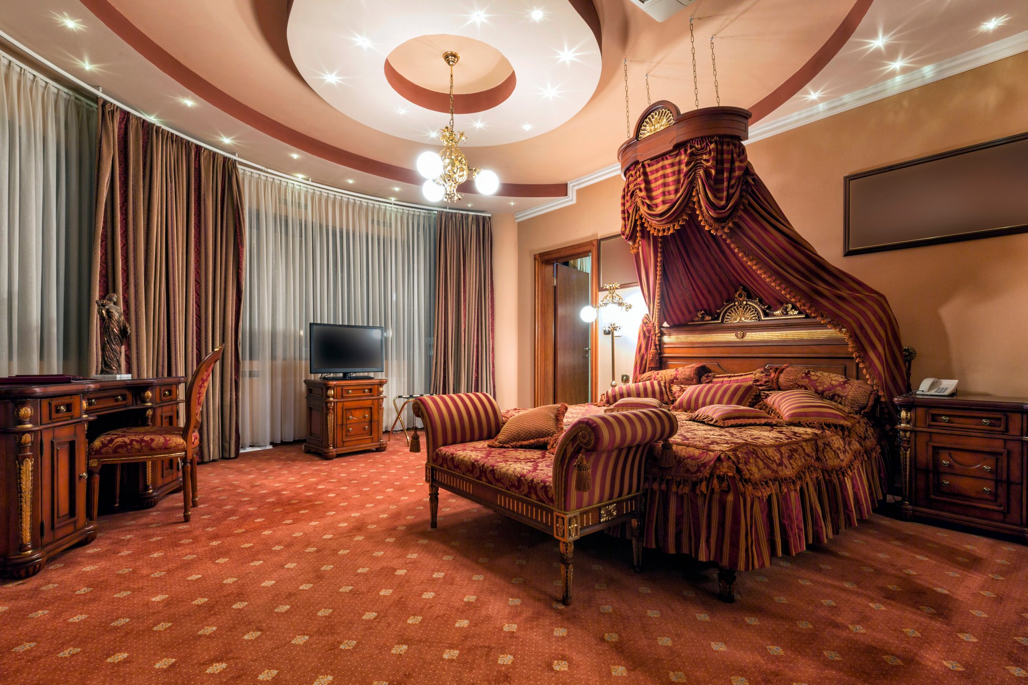The interior of a classic style luxury hotel room.
