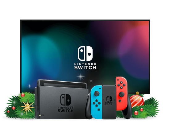 A Nintendo Switch console and controller in front of a television and some holiday decorations.