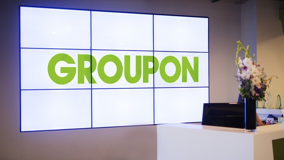 Nine screens spelling out "Groupon" at the company's office entrance.